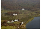 Foto's Boten op land na orkaan