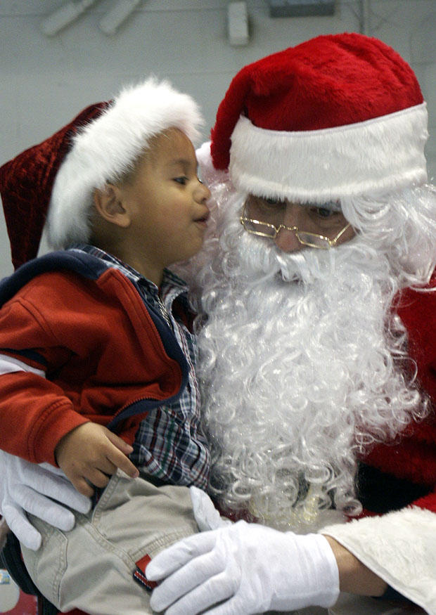 kind bij kerstman Foto kind bij kerstman